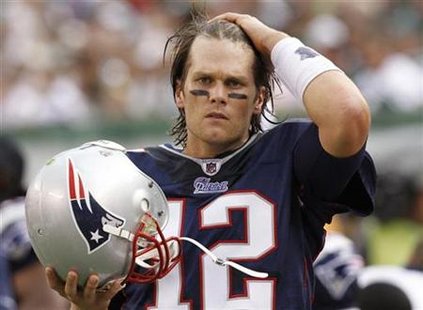 New England Patriots' quarterback Tom Brady prepares to put on his helmet before running onto the field in the second quarter against the New York Jets during their NFL football game in East Rutherford, New Jersey, September 19, 2010. REUTERS/Gary Hershorn
New England Patriots' quarterback Tom Brady prepares to put on his helmet before running onto the field in the second quarter against the New York Jets during their NFL football game in East Rutherford, New Jersey, September 19, 2010. REUTERS/Gary Hershorn