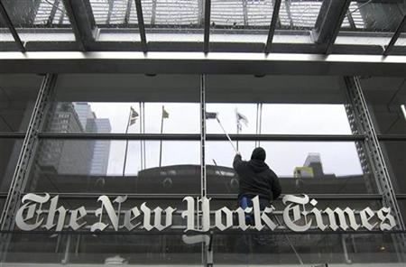 A window washer cleans the windows above the front door of the New York Times building in New York in this March 26, 2010 file photo. REUTERS/Gary Hershorn
A window washer cleans the windows above the front door of the New York Times building in New York in this March 26, 2010 file photo. REUTERS/Gary Hershorn
