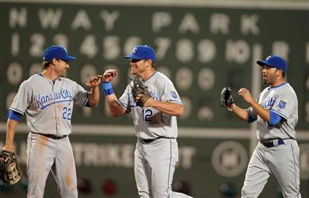 
Kansas City Royals' Scott Podsednik, Mitch Maier and David DeJesus (L-R) celebrate their win over the Boston Red Sox during their American League MLB baseball game at Fenway Park in Boston, Massachusetts May 27, 2010. REUTERS/Adam Hunger
