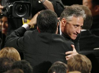 Jon Stewart hugs Stephen Colbert (back facing camera) after winning best variety music or comedy series for "The Daily Show with Jon Stewart" at the 61st annual Primetime Emmy Awards in Los Angeles, California September 20, 2009. REUTERS/Mario Anzuoni
Jon Stewart hugs Stephen Colbert (back facing camera) after winning best variety music or comedy series for "The Daily Show with Jon Stewart" at the 61st annual Primetime Emmy Awards in Los Angeles, California September 20, 2009. REUTERS/Mario Anzuoni