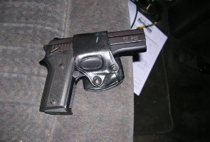 The gun found in the suspect's vehicle. The gun found in the suspect's vehicle.