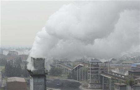 
Smoke billows from a chimney at a coking factory in Hefei, Anhui province October 2, 2010. REUTERS/Stringer
