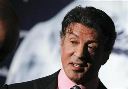 Sylvester Stallone poses for pictures during a photo call promoting his new movie "The Expendables" in Berlin, August 6, 2010. REUTERS/Thomas Peter
Sylvester Stallone poses for pictures during a photo call promoting his new movie "The Expendables" in Berlin, August 6, 2010. REUTERS/Thomas Peter