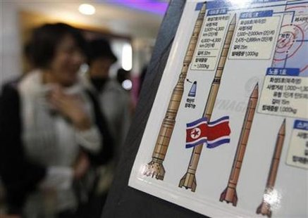 Japanese tourists walk past a display showing North Korea's missile system at a South Korean observation post near the demilitarised zone separating the two Koreas in Paju, about 45 km (28 miles) north of Seoul in this October 13, 2009 file photo. REUTERS/Lee Jae-Won
Japanese tourists walk past a display showing North Korea's missile system at a South Korean observation post near the demilitarised zone separating the two Koreas in Paju, about 45 km (28 miles) north of Seoul in this October 13, 2009 file photo. REUTERS/Lee Jae-Won