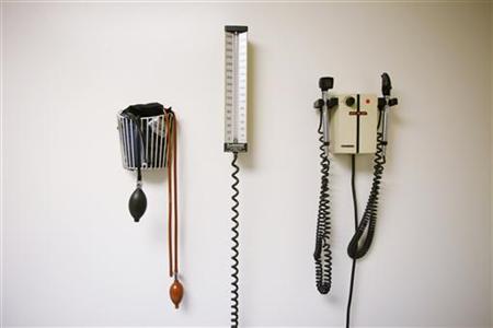 Devices used to take blood pressure, temperature, and examine eyes and ears rest on a wall inside of a doctor's office in New York March 22, 2010. REUTERS/Lucas Jackson
Devices used to take blood pressure, temperature, and examine eyes and ears rest on a wall inside of a doctor's office in New York March 22, 2010. REUTERS/Lucas Jackson