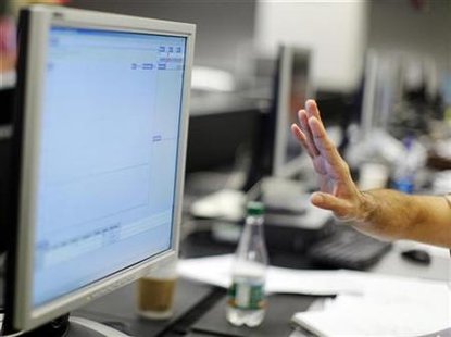 A man gestures before a computer screen in a file photo. REUTERS/Brian Snyder
A man gestures before a computer screen in a file photo. REUTERS/Brian Snyder