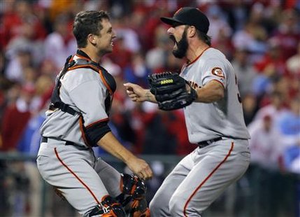 
San Francisco Giants relief pitcher Brian Wilson (R) and catcher Buster Posey celebrate after defeating the Philadelphia Phillies' in Major League Baseball's NLCS playoff series in Philadelphia, October 23, 2010. REUTERS/Tim Shaffer
