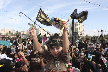 A Palestinian girl waves Islamic Jihad flags during a rally in Gaza City October 29, 2010. Thousands of Palestinians attend a rally marking the 23rd anniversary of the Islamic Jihad movement foundation. REUTERS/Mohammed Salem
A Palestinian girl waves Islamic Jihad flags during a rally in Gaza City October 29, 2010. Thousands of Palestinians attend a rally marking the 23rd anniversary of the Islamic Jihad movement foundation. REUTERS/Mohammed Salem