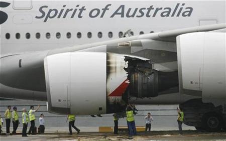 Technicians look at the damaged engine of Qantas Airways A380 passenger plane QF32 after it was forced to make an emergency landing at Changi airport in Singapore November 4, 2010. REUTERS/David Loh
Technicians look at the damaged engine of Qantas Airways A380 passenger plane QF32 after it was forced to make an emergency landing at Changi airport in Singapore November 4, 2010. REUTERS/David Loh