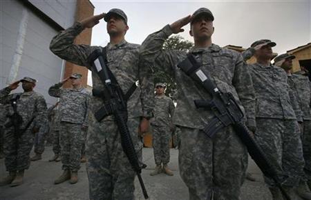 U.S. soldiers salute during a ceremony to mark the anniversary of the September 11, 2001 attacks on the United States, at the main U.S. base, in Bagram, north of Kabul, Afghanistan September 11, 2009. REUTERS/Musadeq Sadeq/Pool
U.S. soldiers salute during a ceremony to mark the anniversary of the September 11, 2001 attacks on the United States, at the main U.S. base, in Bagram, north of Kabul, Afghanistan September 11, 2009. REUTERS/Musadeq Sadeq/Pool