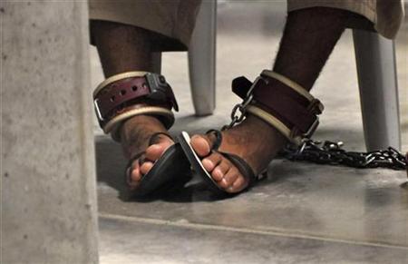 In this photo, reviewed by a U.S. Department of Defense official, a Guantanamo detainee's feet are shackled to the floor as he attends a "Life Skills" class inside the Camp 6 high-security detention facility at Guantanamo Bay U.S. Naval Base April 27, 2010. REUTERS/Michelle Shephard/Pool
In this photo, reviewed by a U.S. Department of Defense official, a Guantanamo detainee's feet are shackled to the floor as he attends a "Life Skills" class inside the Camp 6 high-security detention facility at Guantanamo Bay U.S. Naval Base April 27, 2010. REUTERS/Michelle Shephard/Pool