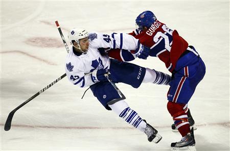 Montreal Canadiens Josh Gorges (R) collides with Toronto Maple Leafs Nazem Kadri during the third period of NHL hockey play in Montreal, November 20, 2010. REUTERS/Shaun Best
Montreal Canadiens Josh Gorges (R) collides with Toronto Maple Leafs Nazem Kadri during the third period of NHL hockey play in Montreal, November 20, 2010. REUTERS/Shaun Best