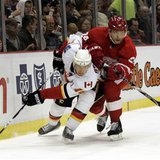 Detroit Red Wings defensman Ruslan Salei (R) and Calgary Flames center Matt Stajan case the puck around the back of the Red wings net during the second period of their NHL hockey game in Detroit, Michigan November 21, 2010. REUTERS/Rebecca Cook
Detroit Red Wings defensman Ruslan Salei (R) and Calgary Flames center Matt Stajan case the puck around the back of the Red wings net during the second period of their NHL hockey game in Detroit, Michigan November 21, 2010. REUTERS/Rebecca Cook