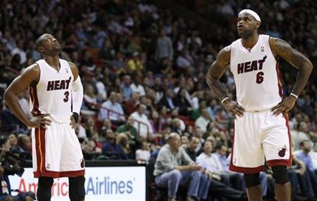 Miami Heat's Dwyane Wade (L) and teammate LeBron James stand waiting for play to begin during the second quarter of their NBA game against the Indiana Pacers in Miami November 22, 2010. REUTERS/Hans Deryk
Miami Heat's Dwyane Wade (L) and teammate LeBron James stand waiting for play to begin during the second quarter of their NBA game against the Indiana Pacers in Miami November 22, 2010. REUTERS/Hans Deryk