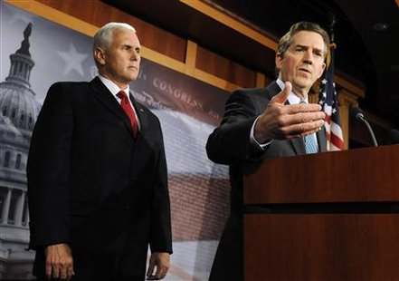 
Senator Jim DeMint (R-SC) (R) and Representative Mike Pence (R-IN) attend a news conference about their goal of permanently extending Bush-era tax rates at the Capitol in Washington, December 2, 2010. REUTERS/Jonathan Ernst
