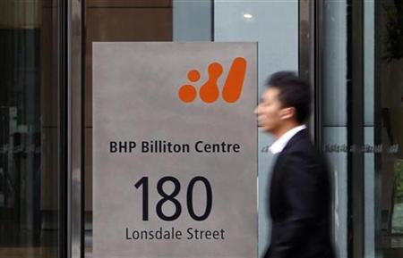 
A man walks past the head office of BHP Billiton in central Melbourne October 18, 2010. REUTERS/Mick Tsikas
