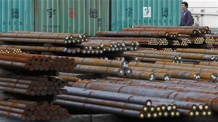 
A worker walks in a steel collection facility in Tokyo November 30, 2010. REUTERS/Toru Hanai
