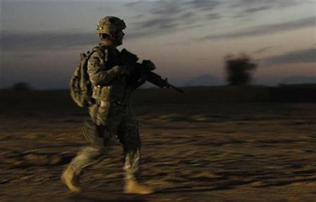 A U.S. soldier from 2nd Brigade Special Troops Battalion walks during an early morning patrol in Zhari district in Kandahar Province, Afghanistan, November 22, 2010. REUTERS/Peter Andrews
A U.S. soldier from 2nd Brigade Special Troops Battalion walks during an early morning patrol in Zhari district in Kandahar Province, Afghanistan, November 22, 2010. REUTERS/Peter Andrews