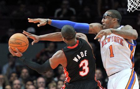 New York Knicks forward Amar'e Stoudemire (1) fouls Miami Heat guard Dwyane Wade during the first quarter of their NBA basketball game at Madison Square Garden in New York December 17, 2010. REUTERS/Ray Stubblebine
New York Knicks forward Amar'e Stoudemire (1) fouls Miami Heat guard Dwyane Wade during the first quarter of their NBA basketball game at Madison Square Garden in New York December 17, 2010. REUTERS/Ray Stubblebine