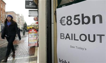 A woman walks along Grafton Street past a newspaper flyer reporting on the government bailout Dublin November 29, 2010. REUTERS/Cathal McNaughton
A woman walks along Grafton Street past a newspaper flyer reporting on the government bailout Dublin November 29, 2010. REUTERS/Cathal McNaughton
