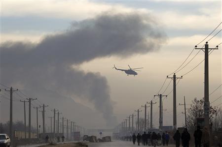 A helicopter flies as smoke billows from a suicide attack in Kabul December 19, 2010. REUTERS/Ahmad Masood
A helicopter flies as smoke billows from a suicide attack in Kabul December 19, 2010. REUTERS/Ahmad Masood