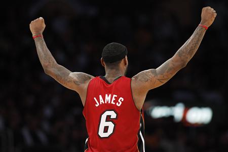 
Miami Heat's LeBron James celebrates a basket by his team against the Los Angeles Lakers during the second half of an NBA basketball game in Los Angeles, December 25, 2010. REUTERS/Danny Moloshok
