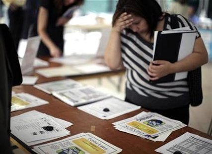 A woman browses job openings at a job fair in Los Angeles, California, October 12, 2010. REUTERS/Lucy Nicholson
A woman browses job openings at a job fair in Los Angeles, California, October 12, 2010. REUTERS/Lucy Nicholson