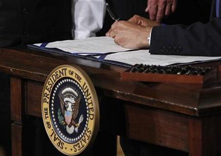 President Barack Obama signs the health insurance reform bill in the East Room at the White House in Washington, March 23, 2010. REUTERS/Jim Young
President Barack Obama signs the health insurance reform bill in the East Room at the White House in Washington, March 23, 2010. REUTERS/Jim Young