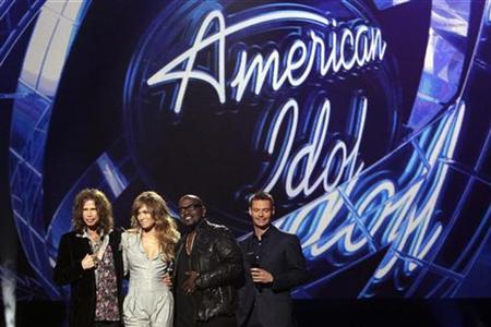Steven Tyler, Jennifer Lopez and Randy Jackson pose with host Ryan Seacrest (L-R) after being announced as the judges for the 10th season of the television show "American Idol" at the Forum in Inglewood, California September 22, 2010. REUTERS/Mario Anzuoni
Steven Tyler, Jennifer Lopez and Randy Jackson pose with host Ryan Seacrest (L-R) after being announced as the judges for the 10th season of the television show "American Idol" at the Forum in Inglewood, California September 22, 2010. REUTERS/Mario Anzuoni