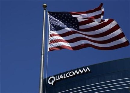 
The U.S. flag flies next to one of Qualcomm's many buildings in San Diego, California, July 22, 2008. REUTERS/Mike Blake
