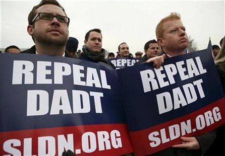Demonstrators listen to a speaker during a protest, urging the Senate not to go on vacation until it passes the National Defense Authorization Act, which includes the repeal of "Don't Ask, Don't Tell," which prevents gay and lesbians from serving openly in the military, on Capital Hill in Washington December 10, 2010. REUTERS/Molly Riley
Demonstrators listen to a speaker during a protest, urging the Senate not to go on vacation until it passes the National Defense Authorization Act, which includes the repeal of "Don't Ask, Don't Tell," which prevents gay and lesbians from serving openly in the military, on Capital Hill in Washington December 10, 2010. REUTERS/Molly Riley