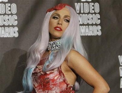 
Lady Gaga, wearing an outfit made of meat, poses in the photo room after winning eight awards at the 2010 MTV Video Music Awards in Los Angeles, September 12, 2010. REUTERS/Mario Anzuoni
