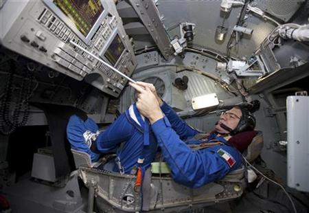 International Space Station (ISS) crew member European Space Agency Astronaut Paolo Nespoli of Italy takes part in a training session for controlling Soyuz spacecraft at the Star City space centre outside Moscow November 13, 2010. REUTERS/Sergei Remezov
International Space Station (ISS) crew member European Space Agency Astronaut Paolo Nespoli of Italy takes part in a training session for controlling Soyuz spacecraft at the Star City space centre outside Moscow November 13, 2010. REUTERS/Sergei Remezov