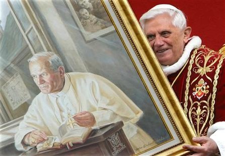 File photo of Pope Benedict XVI's holding a portrait of the late Pope John Paul II during a meeting with the faithful at Wadowice, Poland May 27, 2006. REUTERS/Max Rossi/Files
File photo of Pope Benedict XVI's holding a portrait of the late Pope John Paul II during a meeting with the faithful at Wadowice, Poland May 27, 2006. REUTERS/Max Rossi/Files