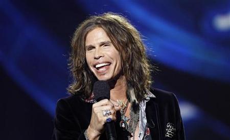 
Steven Tyler speaks on stage after being announced as one the judges for the 10th season of the television show "American Idol" at the Forum in Inglewood, California September 22, 2010. REUTERS/Mario Anzuoni
