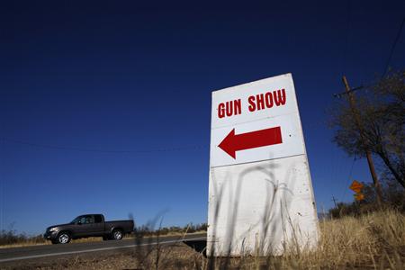 A sign advertises the Crossroads of the West Gun Show at the Pima County Fairgrounds in Tucson, Arizona January 15, 2011. REUTERS/Eric Thayer
A sign advertises the Crossroads of the West Gun Show at the Pima County Fairgrounds in Tucson, Arizona January 15, 2011. REUTERS/Eric Thayer
