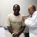 Ernest Sass, 52, (L) winces as he is attended to by Girish Bobby Kapur, M.D. (R) in a room used to see patients who don't require treatment for trauma inside the emergency room at Ben Taub General Hospital in Houston, Texas July 27, 2009. REUTERS/Jessica Rinaldi
Ernest Sass, 52, (L) winces as he is attended to by Girish Bobby Kapur, M.D. (R) in a room used to see patients who don't require treatment for trauma inside the emergency room at Ben Taub General Hospital in Houston, Texas July 27, 2009. REUTERS/Jessica Rinaldi