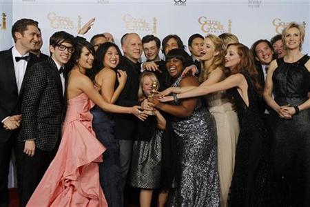 Ryan Murphy (5th L), creator of the TV series 'Glee', and cast members pose with the award for best television comedy series at the 68th annual Golden Globe Awards in Beverly Hills, California, January 16, 2011. REUTERS/Lucy Nicholson
Ryan Murphy (5th L), creator of the TV series 'Glee', and cast members pose with the award for best television comedy series at the 68th annual Golden Globe Awards in Beverly Hills, California, January 16, 2011. REUTERS/Lucy Nicholson