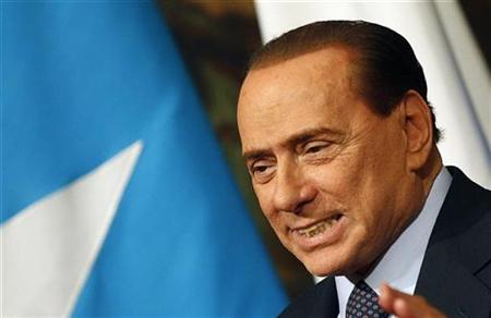 Italian Prime Minister Silvio Berlusconi reacts during a meeting with Somalia's Prime Minister Mohamed Abdullahi Mohamed at Chigi palace in Rome January 20, 2011. REUTERS/Tony Gentile
Italian Prime Minister Silvio Berlusconi reacts during a meeting with Somalia's Prime Minister Mohamed Abdullahi Mohamed at Chigi palace in Rome January 20, 2011. REUTERS/Tony Gentile