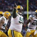 
Green Bay Packers defensive tackle B.J. Raji (90) celebrates his touchdown after intercepting a Chicago Bears pass during the fourth quarter of the NFL NFC Championship football game in Chicago, January 23, 2011. REUTERS/John Gress
