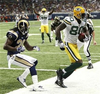 Greenbay Packers' wide receiver Donald Driver (80) scores a touchdown against the St. Louis Rams' Jonathan wade (20) in second quarter NFL football action in St. Louis September 27, 2009. REUTERS/Peter Newcomb
Greenbay Packers' wide receiver Donald Driver (80) scores a touchdown against the St. Louis Rams' Jonathan wade (20) in second quarter NFL football action in St. Louis September 27, 2009. REUTERS/Peter Newcomb