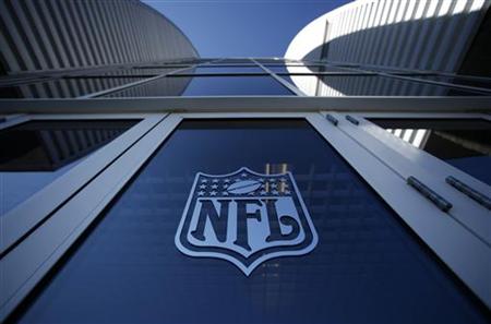 
The NFL logo appears on an entrance door to the football stadium at Super Bowl XLII in Glendale, Arizona February 2, 2008. REUTERS/Mike Blake
