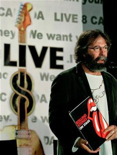 Live 8 Producer Michael Cohl holds up a Rolling Stones folder at the start of a news conference announcing details of the Canadian Live 8 concert in Toronto, in this June 21, 2005 file photo. The Rolling Stones' next tour has not even been announced yet, but it is playing a key role in a legal battle between Cohl who has organized their treks for two decades and concert promoter Live Nation. REUTERS/J.P. Moczulski
Live 8 Producer Michael Cohl holds up a Rolling Stones folder at the start of a news conference announcing details of the Canadian Live 8 concert in Toronto, in this June 21, 2005 file photo. The Rolling Stones' next tour has not even been announced yet, but it is playing a key role in a legal battle between Cohl who has organized their treks for two decades and concert promoter Live Nation. REUTERS/J.P. Moczulski