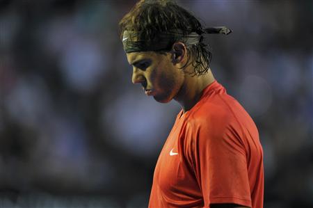 Rafael Nadal of Spain reacts during his quarter-final match against compatriot David Ferrer at the Australian Open tennis tournament in Melbourne January 26, 2011. REUTERS/Paul Crock/Pool
Rafael Nadal of Spain reacts during his quarter-final match against compatriot David Ferrer at the Australian Open tennis tournament in Melbourne January 26, 2011. REUTERS/Paul Crock/Pool