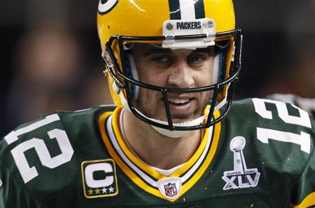 Green Bay Packers quarterback Aaron Rodgers smiles after a touchdown against the Pittsburgh Steelers in the second quarter of NFL Super Bowl XLV football game in Arlington, Texas, February 6, 2011. REUTERS/Jeff Haynes
Green Bay Packers quarterback Aaron Rodgers smiles after a touchdown against the Pittsburgh Steelers in the second quarter of NFL Super Bowl XLV football game in Arlington, Texas, February 6, 2011. REUTERS/Jeff Haynes
