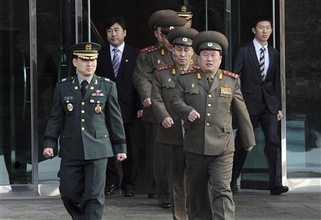 North Korean Colonel Ri Son-kwon (front R) and other North Korean officers walk south of the truce village of Panmunjom in Paju, north of Seoul, February 8, 2011 before their talks with South Korean officers. REUTERS/Defence Ministry/Handout
North Korean Colonel Ri Son-kwon (front R) and other North Korean officers walk south of the truce village of Panmunjom in Paju, north of Seoul, February 8, 2011 before their talks with South Korean officers. REUTERS/Defence Ministry/Handout
