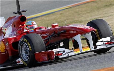 Ferrari Formula One driver Fernando Alonso of Spain drives his new F150 car during the first test session of the year at the Ricardo Tormo racetrack in Cheste, near Valencia, February 1, 2011. REUTERS/Heino Kalis
Ferrari Formula One driver Fernando Alonso of Spain drives his new F150 car during the first test session of the year at the Ricardo Tormo racetrack in Cheste, near Valencia, February 1, 2011. REUTERS/Heino Kalis