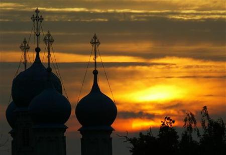 An orthodox cathedral is silhouetted as the sun sets in the village Zelyonaya Sloboda 50 km southeast from Moscow in this picture taken late on July 12, 2004. REUTERS/Viktor Korotayev
An orthodox cathedral is silhouetted as the sun sets in the village Zelyonaya Sloboda 50 km southeast from Moscow in this picture taken late on July 12, 2004. REUTERS/Viktor Korotayev