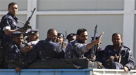 
Yemeni policemen ride their vehicle in Sanaa January 10, 2010. REUTERS/Ahmed Jadallah
