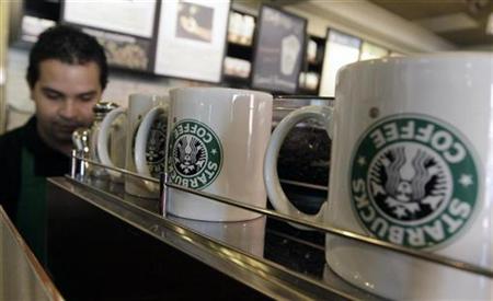 
An employee of Starbucks Corp works inside the branch in Antiguo Cuscatlan, some 8 km (4 miles) southwest of San Salvador November 5, 2010. REUTERS/Luis Galdamez

